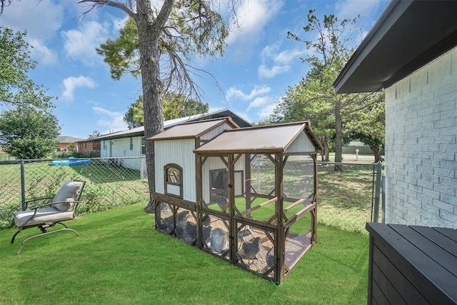 323 W 13th St, Snyder, OK 73566 - fenced backyard with exterior structure and an outbuilding