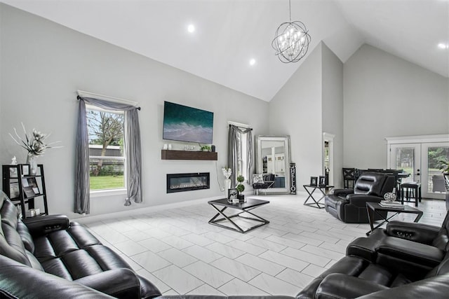 9228 E Cardinal Pl, Midwest City, OK 73130 - living area with high vaulted ceiling, french doors, plenty of natural light, a glass covered fireplace, and recessed lighting