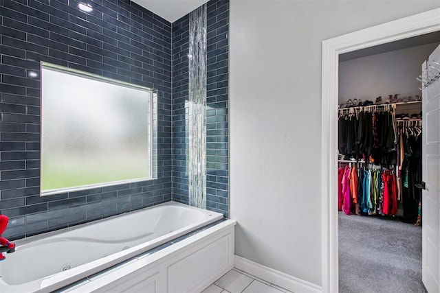 9228 E Cardinal Pl, Midwest City, OK 73130 - bathroom featuring a walk in closet and tile patterned flooring
