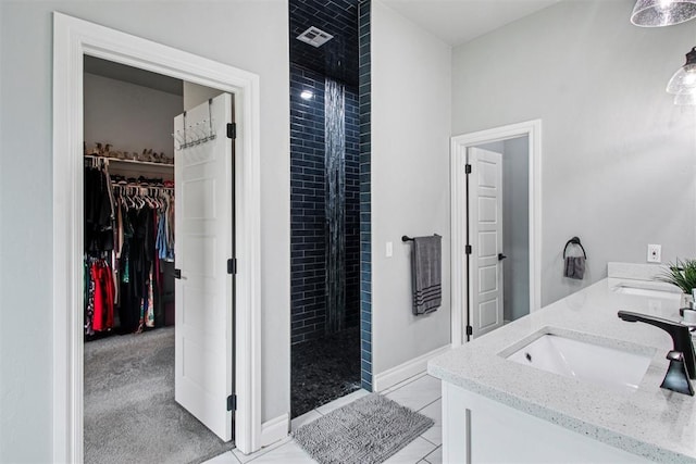 9228 E Cardinal Pl, Midwest City, OK 73130 - bathroom with a shower stall, double vanity, a walk in closet, and tile patterned flooring