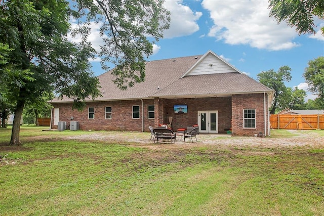 9228 E Cardinal Pl, Midwest City, OK 73130 - back of property with french doors, brick siding, roof with shingles, and a patio area