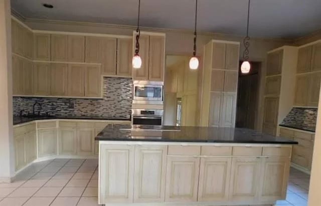 5720 Irvine Dr, Edmond, OK 73025 - kitchen with appliances with stainless steel finishes, dark countertops, backsplash, crown molding, and light tile patterned floors