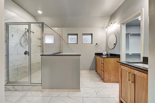 9021 NW 74th St, Yukon, OK 73099 - bathroom featuring marble finish flooring, vanity, a shower stall, and recessed lighting