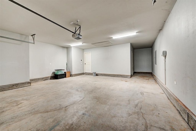 9021 NW 74th St, Yukon, OK 73099 - garage featuring a garage door opener and electric panel
