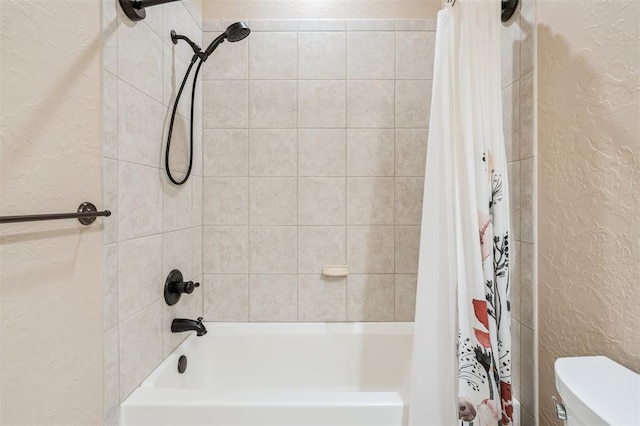 1008 Trisha Ln, Norman, OK 73072 - bathroom with a textured wall and shower / tub combo with curtain