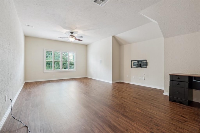 1008 Trisha Ln, Norman, OK 73072 - unfurnished living room featuring ceiling fan, wood finished floors, a textured ceiling, and a textured wall
