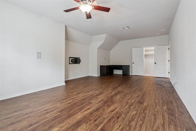 1008 Trisha Ln, Norman, OK 73072 - unfurnished living room featuring wood finished floors, a ceiling fan, and vaulted ceiling