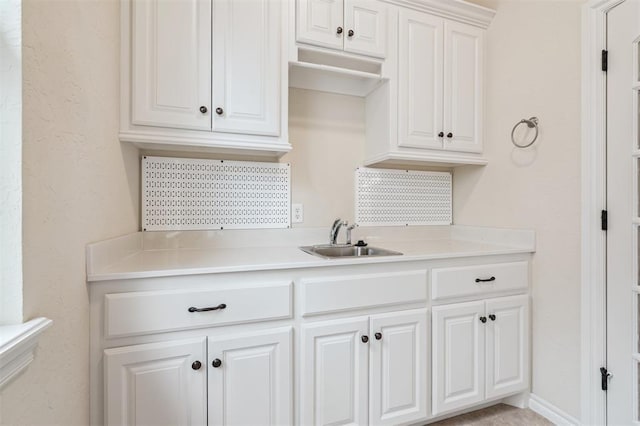 1008 Trisha Ln, Norman, OK 73072 - kitchen featuring light countertops and white cabinets