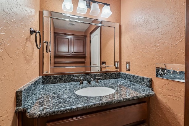 1008 Trisha Ln, Norman, OK 73072 - bathroom featuring a textured wall and vanity