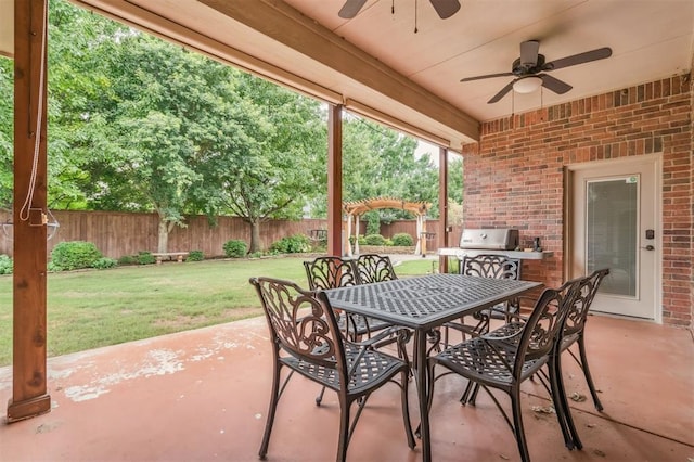 1008 Trisha Ln, Norman, OK 73072 - fenced backyard with a ceiling fan, a patio, outdoor dining area, and area for grilling
