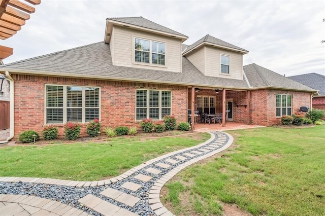 1008 Trisha Ln, Norman, OK 73072 - rear view of property featuring brick siding, a patio, a lawn, and a shingled roof
