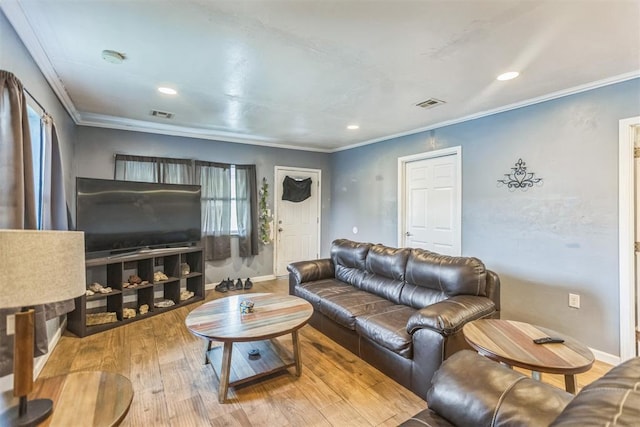 321 W 1st St, Wewoka, OK 74884 - living area featuring wood finished floors, recessed lighting, and crown molding