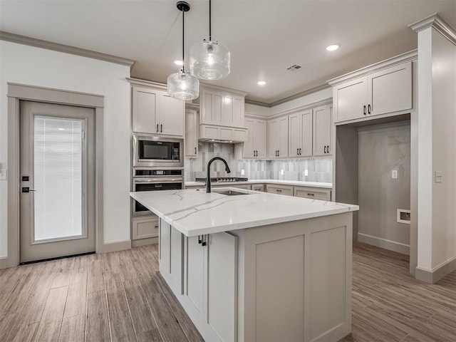 6609 NW 147th St, Oklahoma City, OK 73142 - kitchen with appliances with stainless steel finishes, backsplash, light wood-style floors, light stone counters, and ornamental molding
