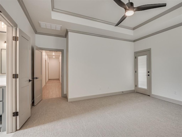 6609 NW 147th St, Oklahoma City, OK 73142 - unfurnished room with a tray ceiling, ornamental molding, light colored carpet, and a ceiling fan