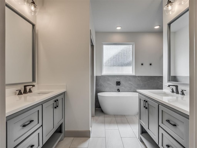 6609 NW 147th St, Oklahoma City, OK 73142 - full bathroom featuring vanity, a freestanding bath, tile patterned floors, and recessed lighting