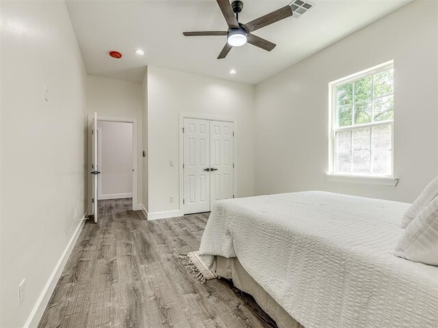 1800 NW 41st St, Oklahoma City, OK 73118 - bedroom with wood finished floors, a closet, recessed lighting, and ceiling fan
