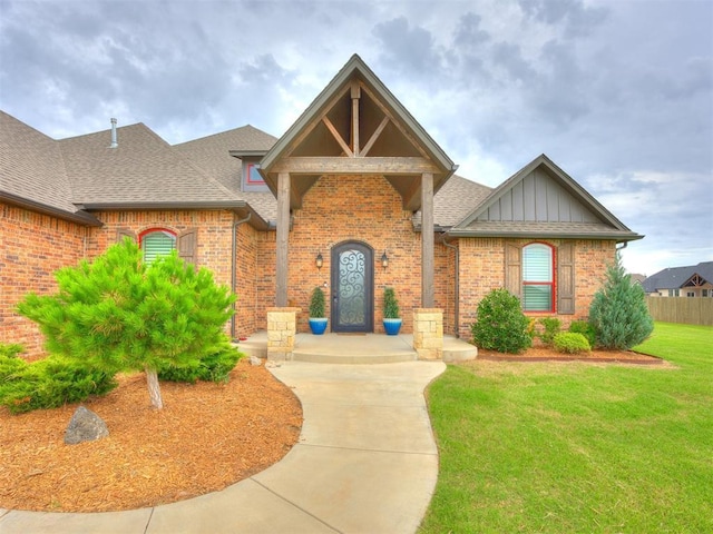 4000 Timber Creek Way, Moore, OK 73165 - view of front of home with roof with shingles, brick siding, and board and batten siding