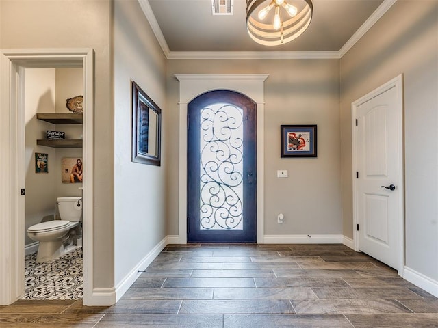 4000 Timber Creek Way, Moore, OK 73165 - foyer featuring ornamental molding and wood tiled floors