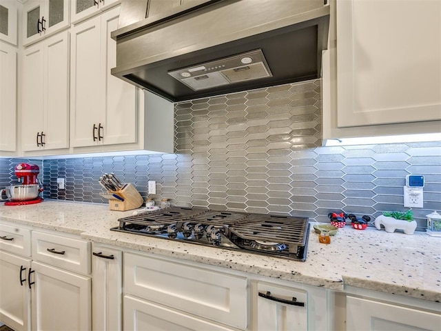 4000 Timber Creek Way, Moore, OK 73165 - kitchen featuring extractor fan, black gas cooktop, white cabinetry, and decorative backsplash