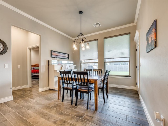 4000 Timber Creek Way, Moore, OK 73165 - dining area featuring crown molding and wood finished floors