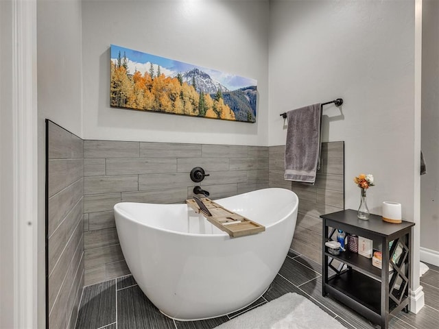 4000 Timber Creek Way, Moore, OK 73165 - full bath with tile walls, a freestanding bath, a wainscoted wall, and tile patterned flooring