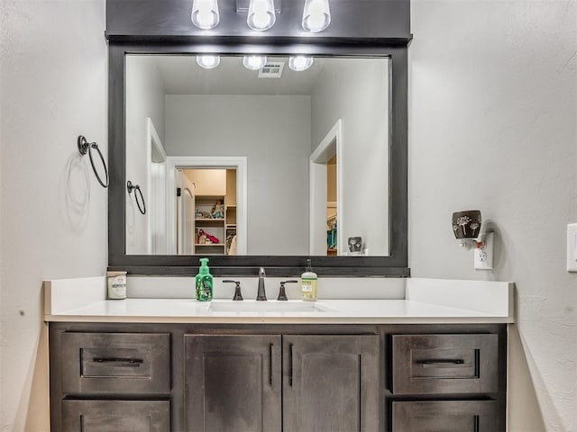 4000 Timber Creek Way, Moore, OK 73165 - bathroom featuring vanity and a walk in closet