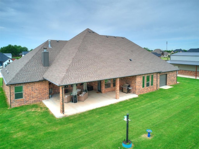 4000 Timber Creek Way, Moore, OK 73165 - back of house featuring brick siding, a patio area, a yard, and a shingled roof