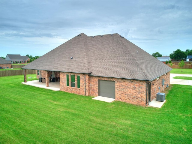 4000 Timber Creek Way, Moore, OK 73165 - rear view of house featuring brick siding, a shingled roof, a patio area, and a garage