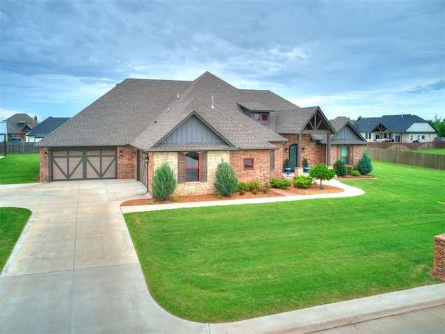4000 Timber Creek Way, Moore, OK 73165 - view of front of house with driveway, board and batten siding, brick siding, and roof with shingles