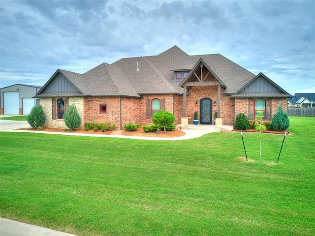 4000 Timber Creek Way, Moore, OK 73165 - craftsman inspired home with board and batten siding, a front lawn, roof with shingles, an outbuilding, and brick siding
