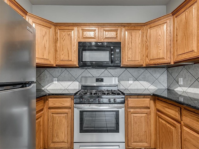 10808 Cheshire Ct, Yukon, OK 73099 - kitchen with appliances with stainless steel finishes, dark stone counters, decorative backsplash, and brown cabinetry