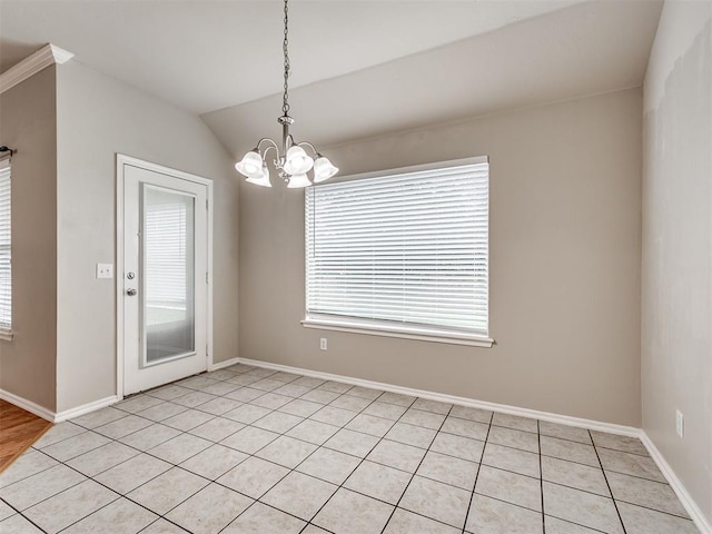 10808 Cheshire Ct, Yukon, OK 73099 - spare room with a chandelier, light tile patterned floors, and vaulted ceiling