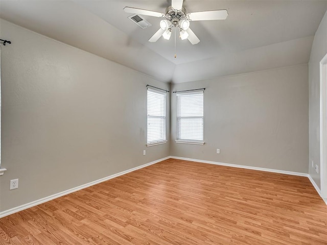 10808 Cheshire Ct, Yukon, OK 73099 - empty room with light wood-style flooring, ceiling fan, and vaulted ceiling
