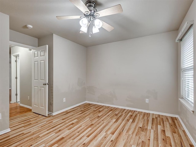 10808 Cheshire Ct, Yukon, OK 73099 - unfurnished room featuring light wood-type flooring, healthy amount of natural light, a smoke detector, and ceiling fan