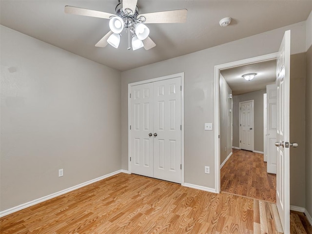 10808 Cheshire Ct, Yukon, OK 73099 - unfurnished bedroom with light wood-style floors, a closet, and ceiling fan