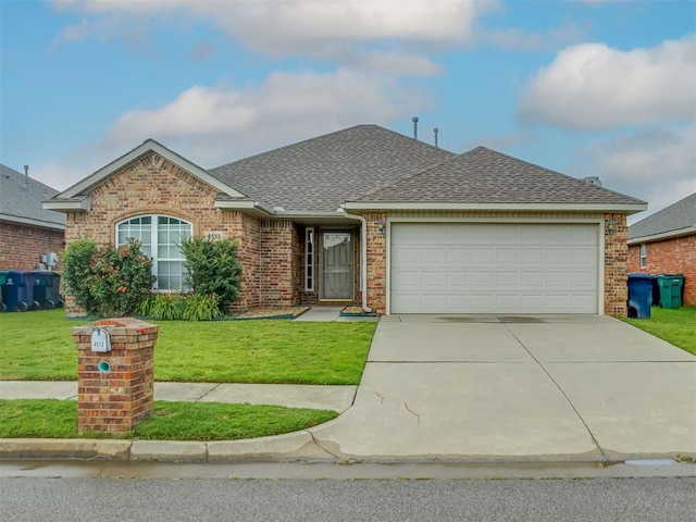 4513 SE 79th Ter, Oklahoma City, OK 73135 - view of front of home featuring roof with shingles, brick siding, a garage, a front lawn, and driveway