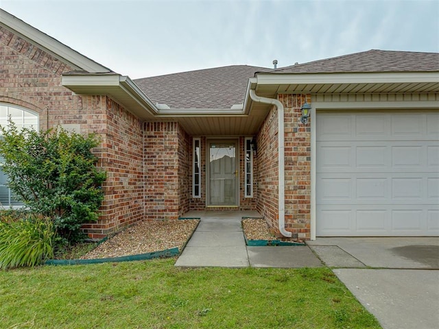 4513 SE 79th Ter, Oklahoma City, OK 73135 - property entrance featuring roof with shingles, brick siding, and an attached garage