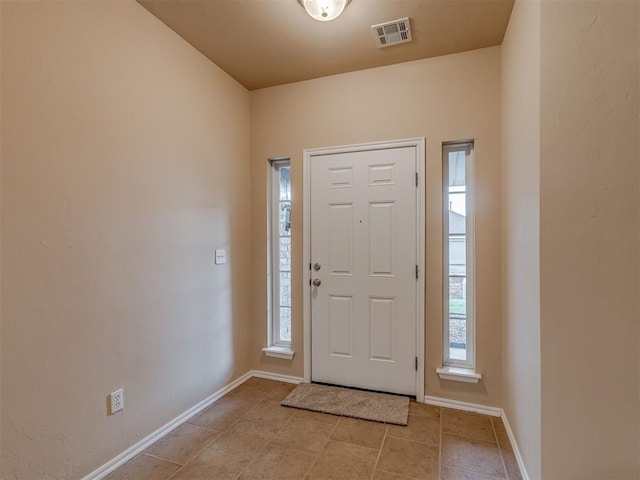 4513 SE 79th Ter, Oklahoma City, OK 73135 - foyer with healthy amount of natural light and light tile patterned flooring