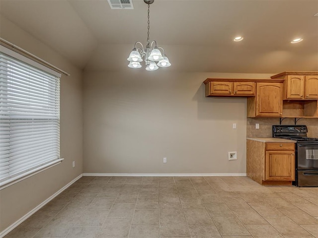 4513 SE 79th Ter, Oklahoma City, OK 73135 - kitchen with black range with electric cooktop, healthy amount of natural light, decorative light fixtures, tasteful backsplash, and recessed lighting