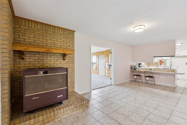 104951 S 3440th Rd, Meeker, OK 74855 - living area with light tile patterned floors and a fireplace
