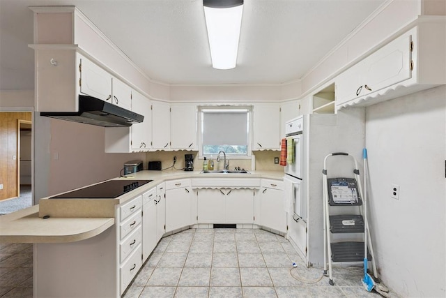 104951 S 3440th Rd, Meeker, OK 74855 - kitchen with under cabinet range hood, black electric stovetop, light countertops, white cabinets, and light tile patterned flooring