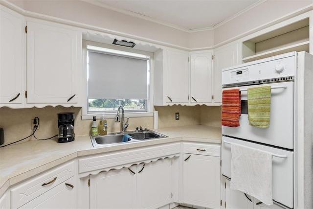 104951 S 3440th Rd, Meeker, OK 74855 - kitchen featuring white double oven, white cabinets, and crown molding
