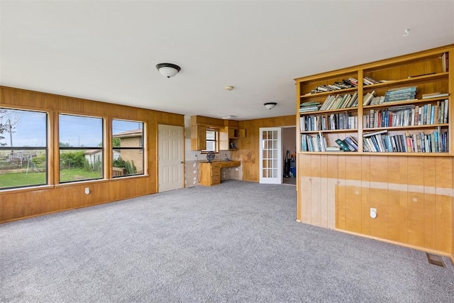 104951 S 3440th Rd, Meeker, OK 74855 - unfurnished living room with carpet and wood walls