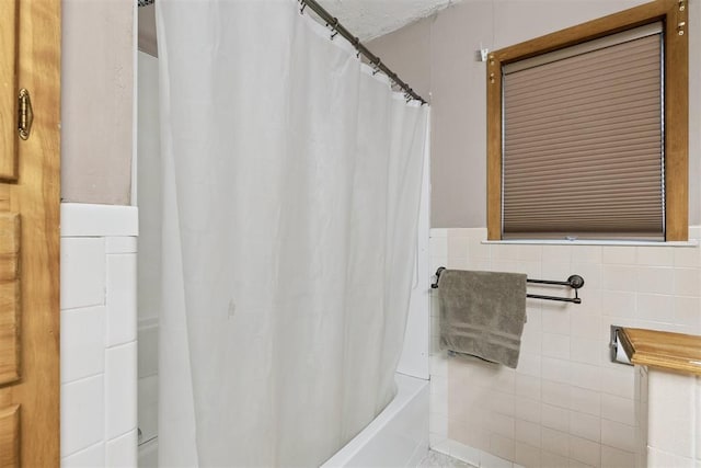 104951 S 3440th Rd, Meeker, OK 74855 - bathroom featuring shower / bath combination with curtain and tile walls