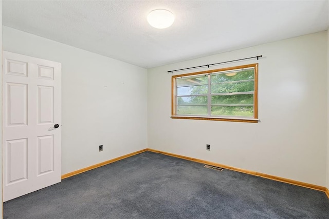 104951 S 3440th Rd, Meeker, OK 74855 - spare room with dark carpet and baseboards