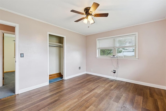 104951 S 3440th Rd, Meeker, OK 74855 - unfurnished bedroom with wood finished floors, ornamental molding, a closet, and ceiling fan