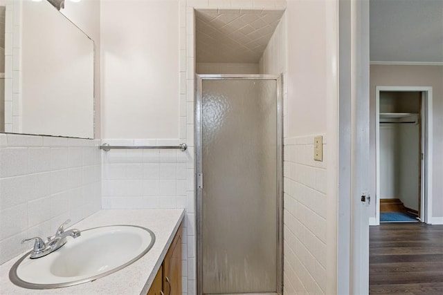 104951 S 3440th Rd, Meeker, OK 74855 - full bath with tile walls, vanity, a shower stall, crown molding, and wood finished floors