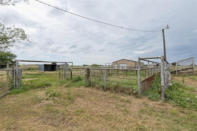 104951 S 3440th Rd, Meeker, OK 74855 - view of yard featuring a rural view, an outdoor structure, and a detached garage