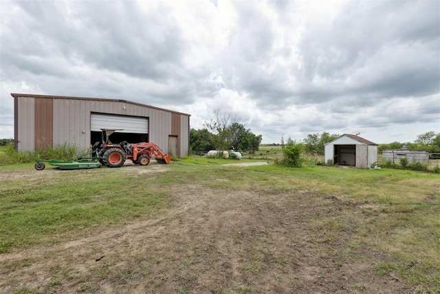 104951 S 3440th Rd, Meeker, OK 74855 - view of yard featuring a garage, a pole building, and an outbuilding