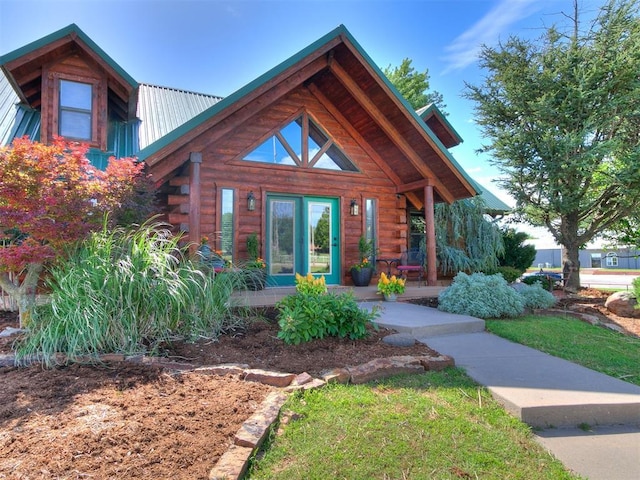 15701 S Pennsylvania Ave, Oklahoma City, OK 73170 - log home featuring log exterior, covered porch, and a metal roof